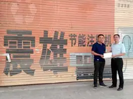 The winner in the front the factory at ChinaPlas 2015 Grand Lucky Draw